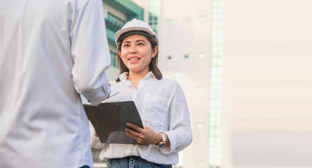 Businesswoman helmet work smart outdoor teamworkの写真素材