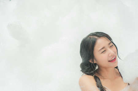 Beauty women in foam party happy in summerの写真素材