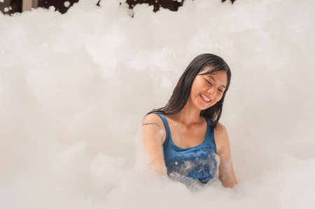 Beauty women in foam party happy in summerの写真素材