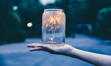 Hand hold firework celebrate Merry Christmas and happy new yearの写真素材