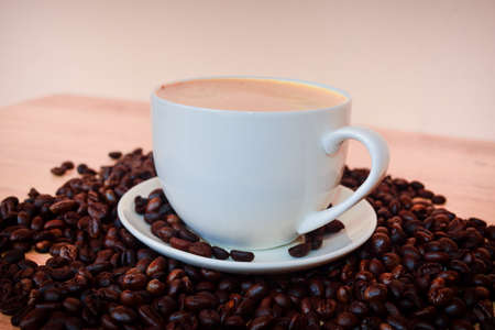 coffee milk Latte with beans on wooden table for coffee shop concept,Food and drinkの写真素材