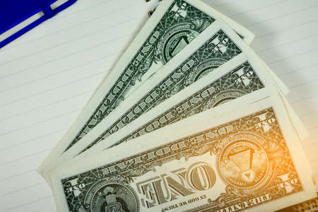 dollar for every day shopping,One dollar banknote is on wood floor,Money of Americaの写真素材
