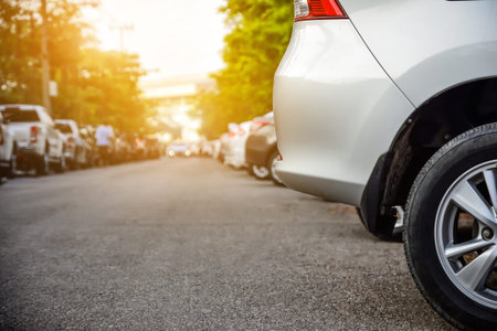 Car parked row on road,Cars parking in line on streetの写真素材