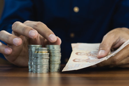 Hand counting money coins stack business financeの写真素材
