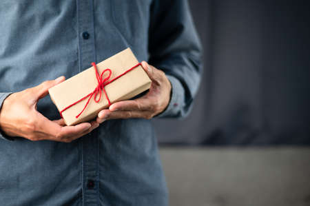 Hand holding gift box, new year gift box, Christmas gift box ,copy space. Christmas, hew year, birthday concept.の写真素材
