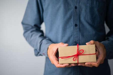 Hand holding gift box, new year gift box, Christmas gift box ,copy space. Christmas, hew year, birthday concept.の写真素材