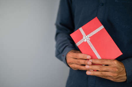 Hand holding gift box, new year gift box, Christmas gift box ,copy space. Christmas, hew year, birthday concept.の写真素材