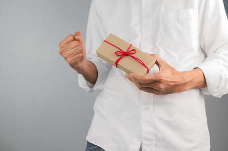 Hand holding gift box, new year gift box, Christmas gift box ,copy space. Christmas, hew year, birthday concept.の写真素材