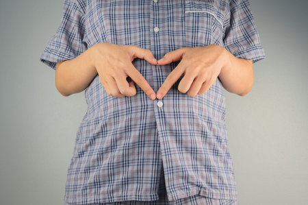 pregnant woman holding her stomachの写真素材