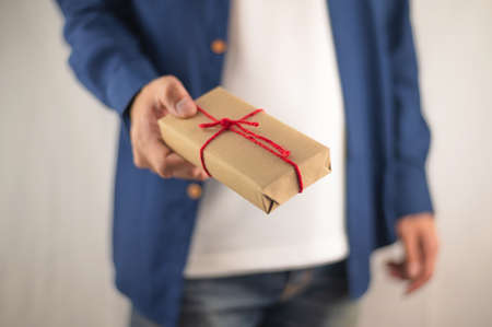 Person holding gift box, new year gift box, Christmas gift box ,copy space. Christmas, hew year, birthday concept.の写真素材