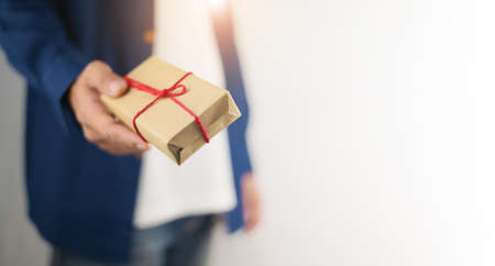 People holding gift box, new year gift box, Christmas gift box ,copy space. Christmas, hew year, birthday concept.の写真素材
