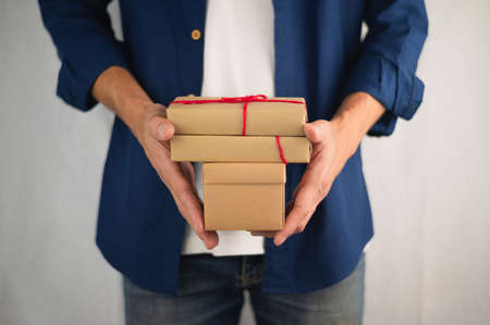 People holding gift box, new year gift box, Christmas gift box ,copy space. Christmas, hew year, birthday concept.の写真素材