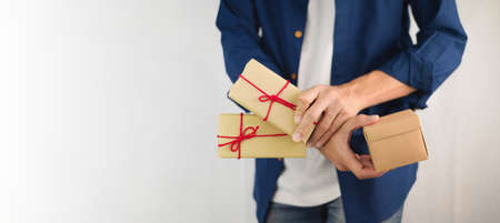 Closeup hand holding gift box, new year gift box, Christmas gift box ,copy space. Christmas, hew year, birthday concept.の写真素材