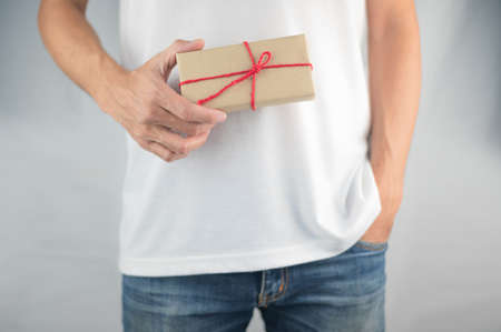 Person holding gift box, new year gift box, Christmas gift box ,copy space. Christmas, hew year, birthday concept.の写真素材