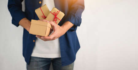 Hand holding gift box, new year gift box, Christmas gift box ,copy space. Christmas, hew year, birthday concept.の写真素材