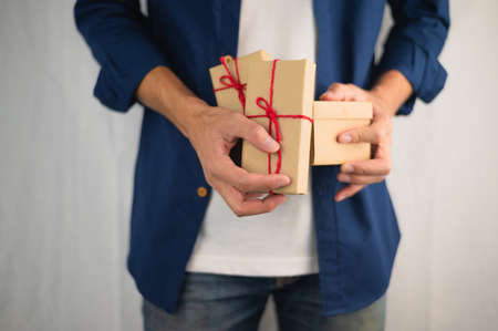 Hand holding gift box, new year gift box, Christmas gift box ,copy space. Christmas, hew year, birthday concept.の写真素材