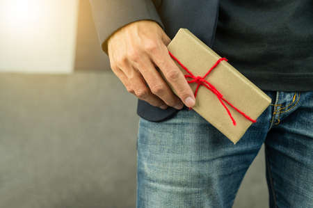 Person holding gift box, new year gift box, Christmas gift box ,copy space. Christmas, hew year, birthday concept.の写真素材