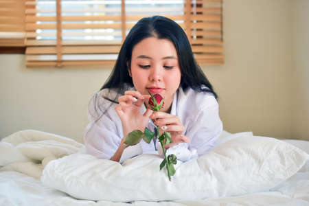 Lovely Happy women get up on bedroom morningの写真素材