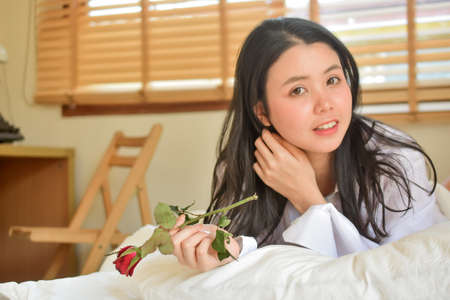 Lovely Happy women get up on bedroom morningの写真素材