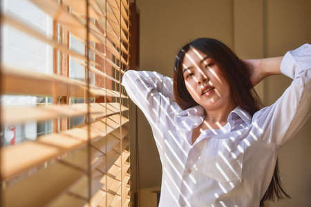 Happy women get up on bedroom morningの写真素材