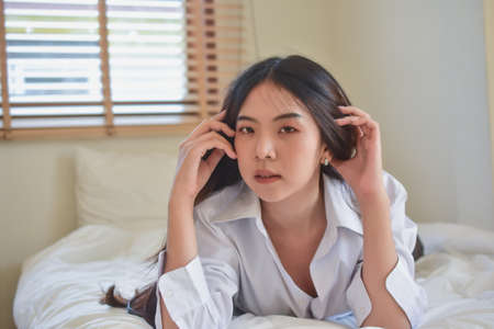 Lovely Happy women get up on bedroom morningの写真素材