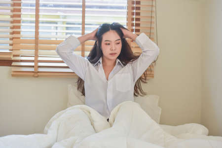 Lovely Happy women get up on bedroom morningの写真素材