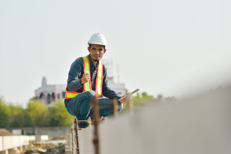 Engineer inspector on  site construction by tablet technology