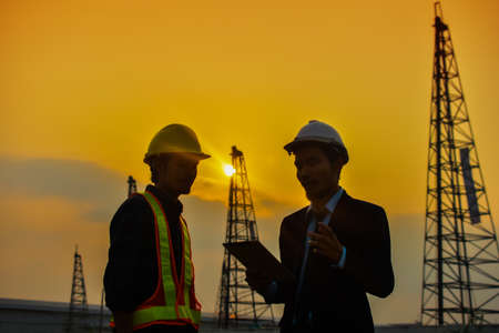 Two Engineer work on site construction talk tablet , Engineer work professionalの写真素材