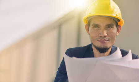 Worker Engineer Engineering work with blue print  Architecture designの写真素材