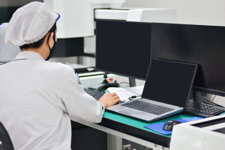 Operator working with computer design product in factory industryの写真素材