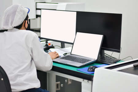 Operator working with computer design product in factory industryの写真素材