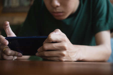 Closeup hand using mobile smartphoneの写真素材
