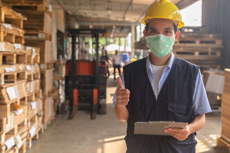 Worker checking raw material inventory in  factoryの写真素材
