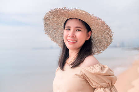 pregnant woman traveling to the sea happyの写真素材