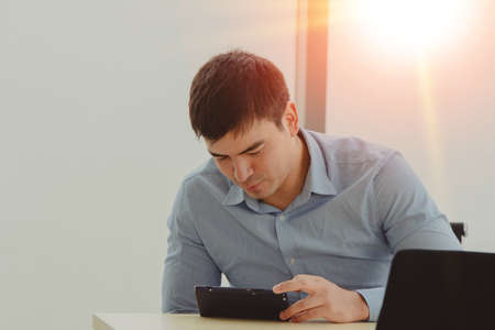 Man trading online on mobile smartphone trade stock marketの写真素材