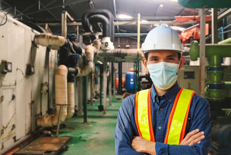Engineer working in factory for industrial with technology machine equipmentの写真素材