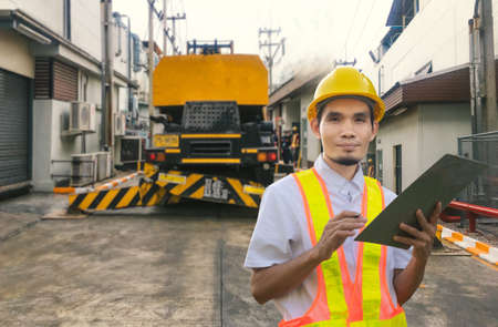 Engineer working in factory for industrial with technology machine equipmentの写真素材