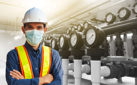 Engineer working in factory for industrial with technology machine equipmentの写真素材