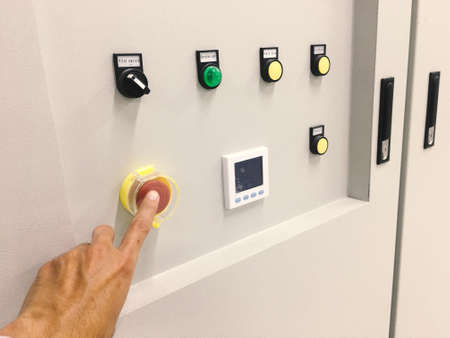 hand touch on button machine in factory industrialの写真素材