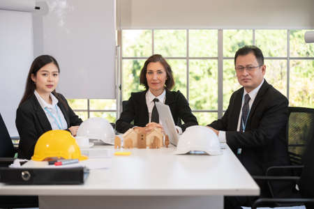 Business team and Engineer Architecture talking in meeting plan construction projectの写真素材