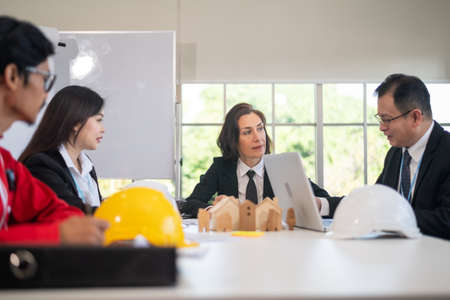 Business team and Engineer Architecture talking in meeting plan construction projectの写真素材