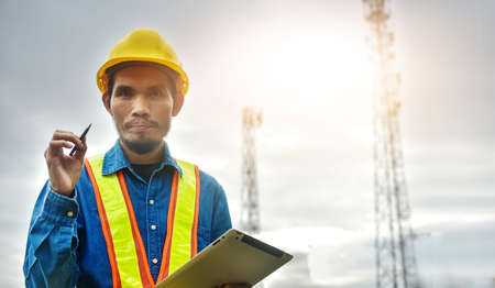 Engineer holding tablet working technology professionalの写真素材