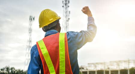 Professional engineer standing outdoors on construction site  working.の写真素材
