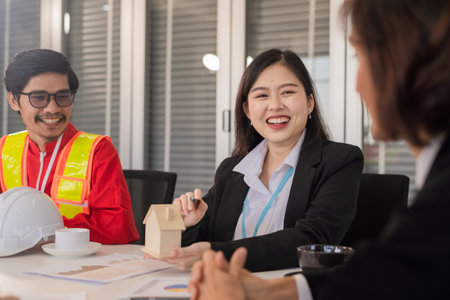 Happy people business team talking discussion construction projectの写真素材
