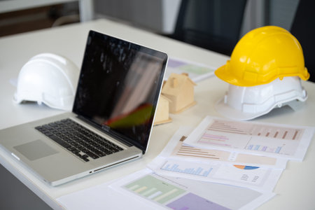 Laptop computer on desk office engineer construction or Architecture design