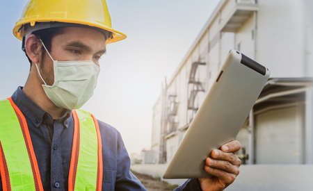Safety Engineer using tablet inspection efficiency facility manufacturing of factory , Designer architecture engineering, Workplace production controlの写真素材