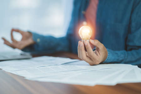 hand holding light bulb idea concept innovation inspirationの写真素材