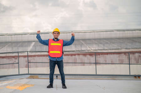 Asian engineer checking on solar power on the roof of factory solar cell green energyの写真素材