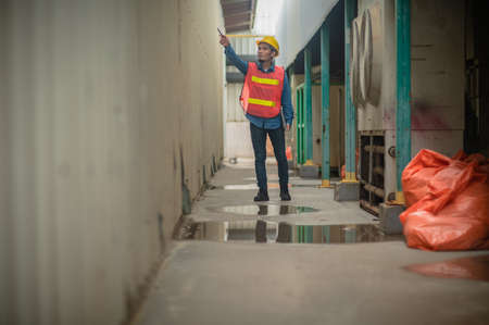 Asian man technician worker inspecting key condition control in factoryの写真素材
