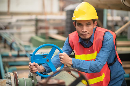 Asian engineer Indonesian employee worker working metal heavy factory plant, Technician Workman...
